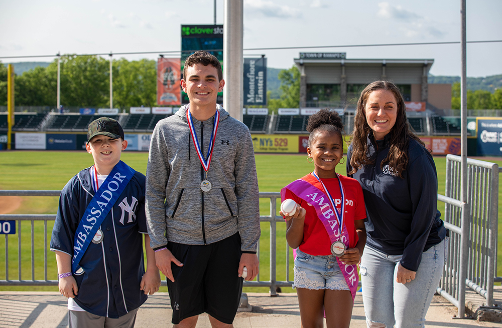 Maria Fareri Children's Hospital ambassadors (L-R) Chase Pultz, Jack Boyle and Camryn Kellam with WMCHealth's Elissa Chessari